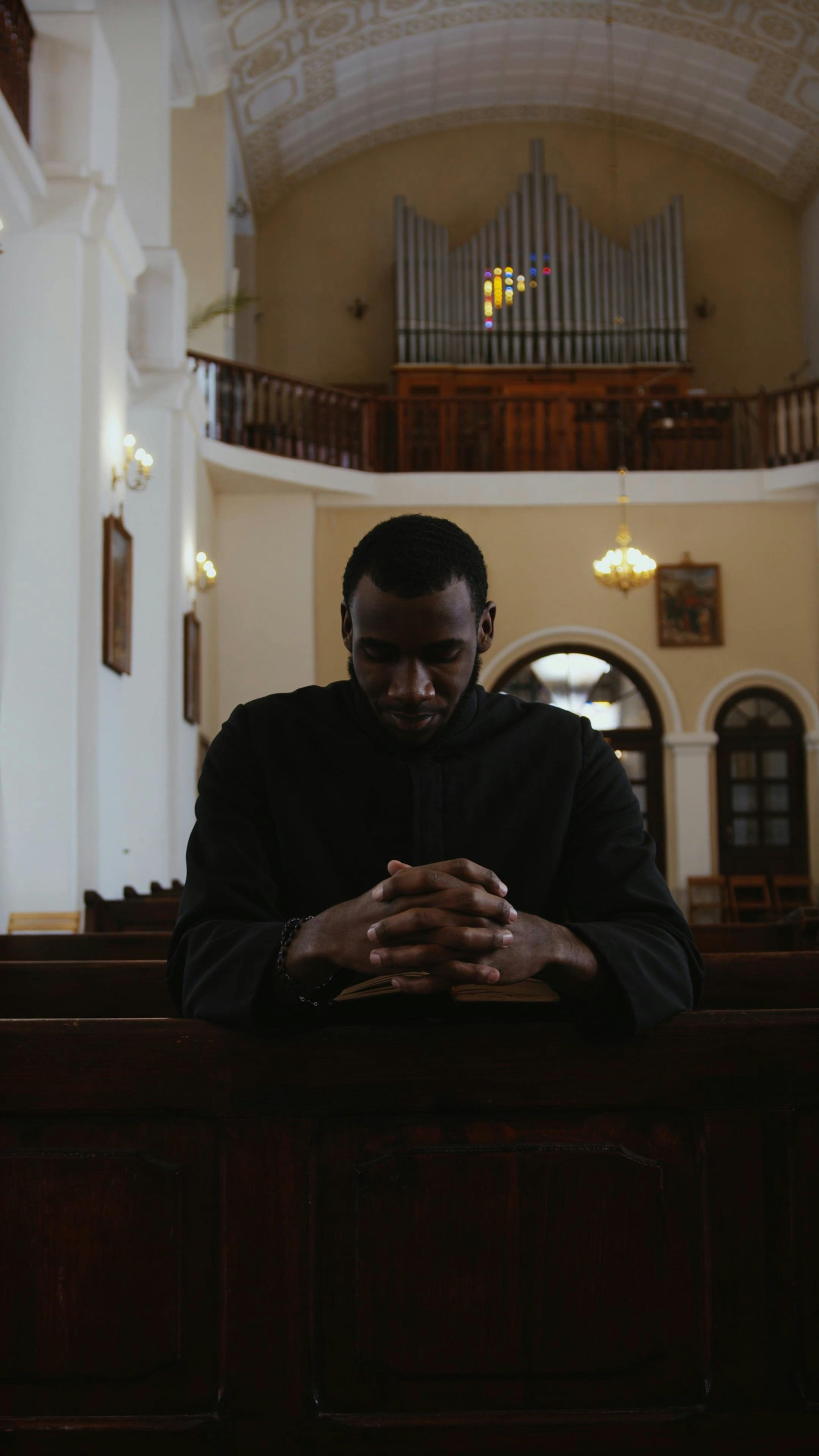 Priest Praying On Knees · Free Stock Video