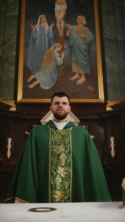 Priest Praying In The Church