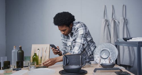 Person Taking Photo of a Glass using a Smartphone