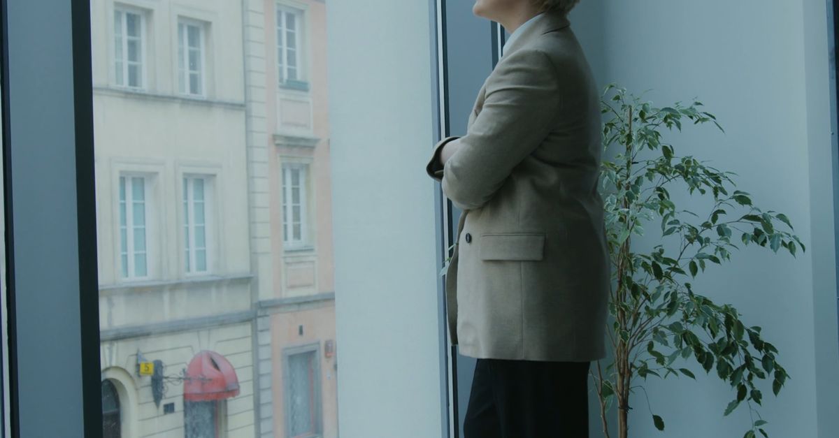 A Woman Looking Outside a Glass Window Free Stock Video Footage ...