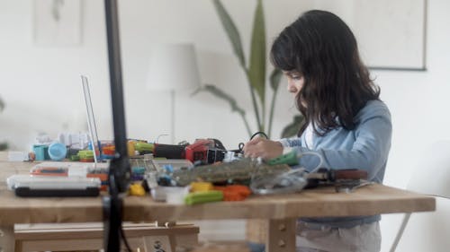 Girl Fixing Electronics