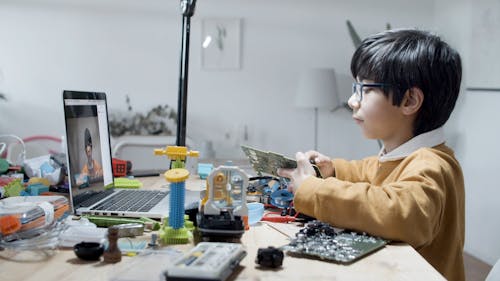 A Boy making his Science Project