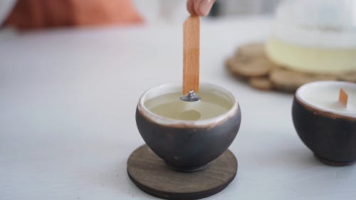 A Person Making a Candle