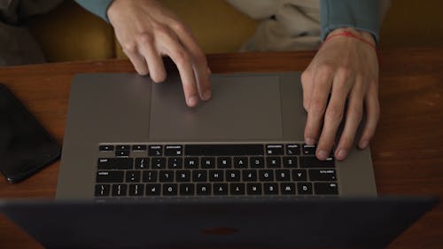 A Person Pointing a Finger in a Touchpad