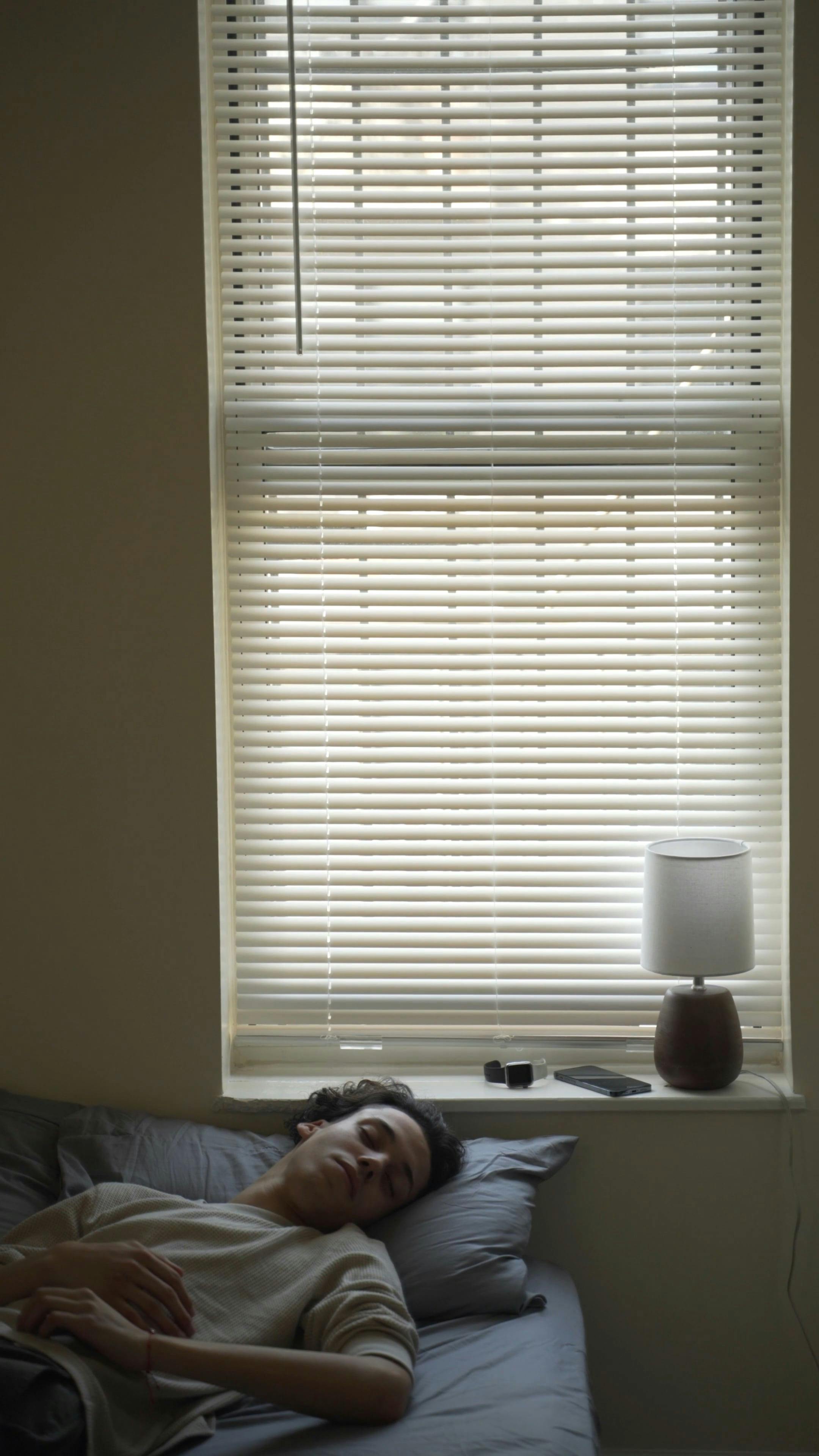 A Man Wrapping Himself in the Blanket and Falling Off Bed · Free Stock