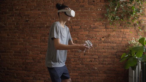 A Man Playing a Virtual Reality Game