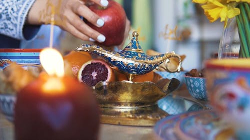 A Person Arranging Fruits in a Plate