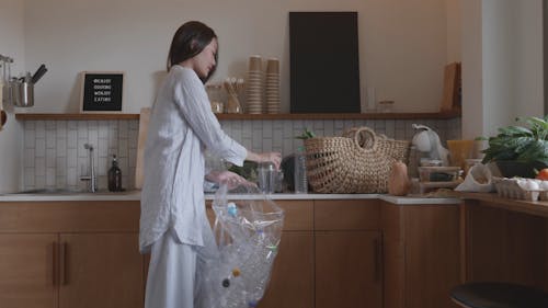 Woman Collecting Plastic Bottles