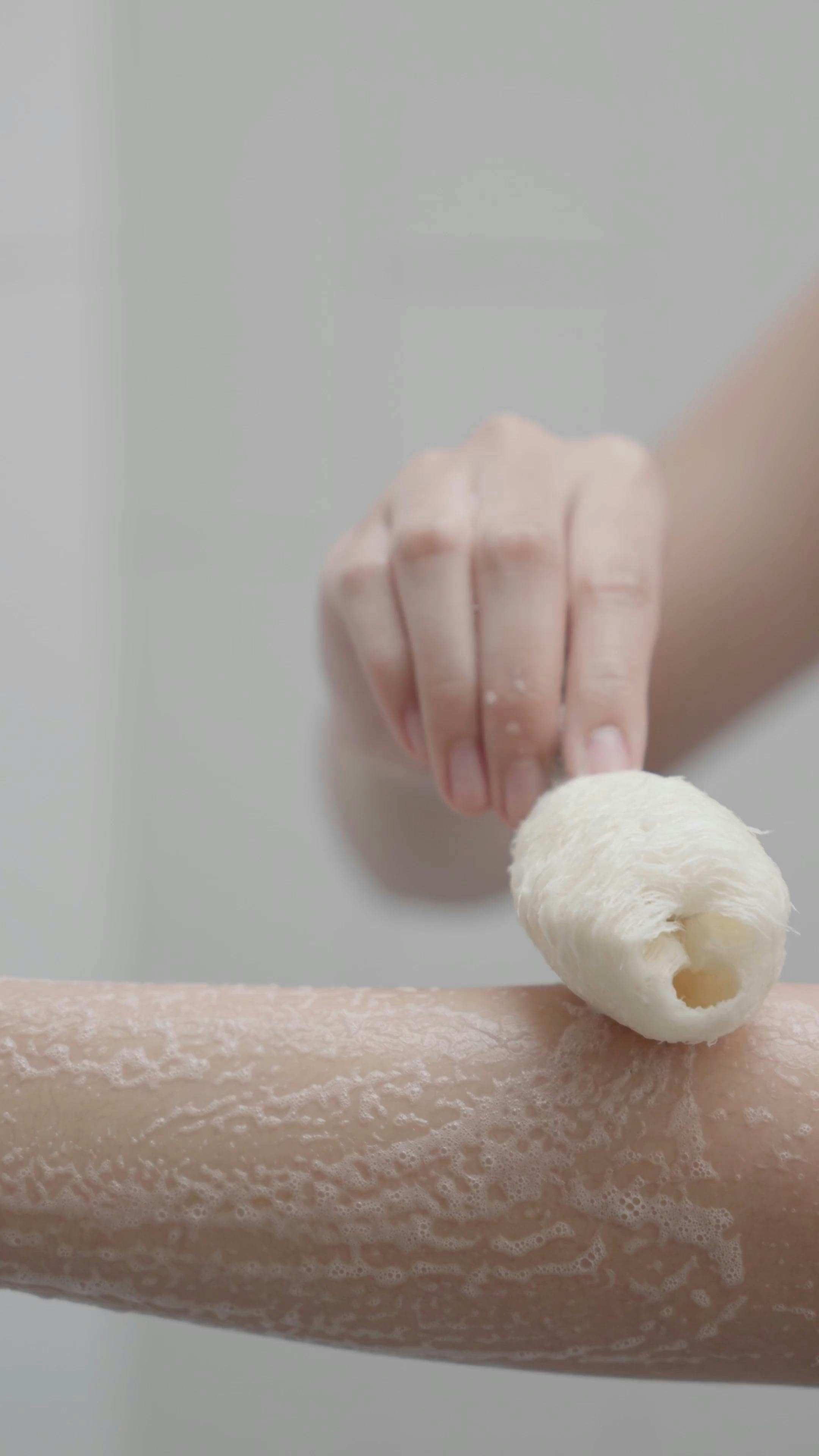 Scrubbing Arms Using a Loofah · Free Stock Video
