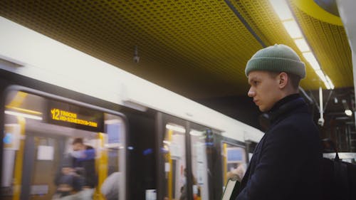 A Man Patiently Waiting for His Train