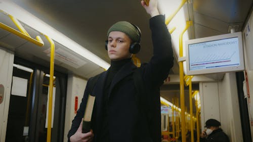 Man Standing Inside a Train