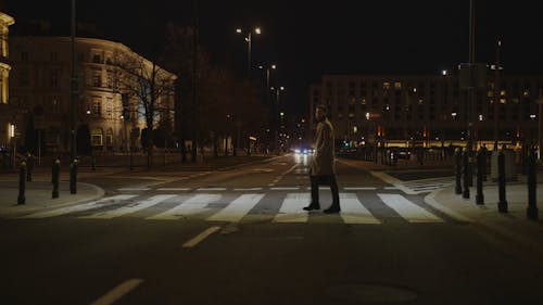 A Man Walking Crossing the Street
