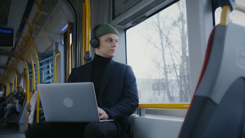 Man Using a Laptop Inside the Train