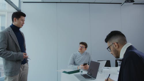 A Man Discussing in Front of the Team