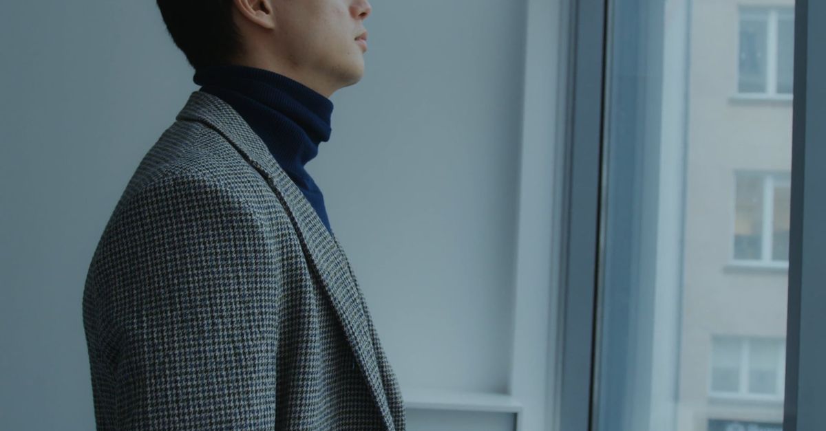 Man Standing by the Window Looking Outside Free Stock Video Footage ...