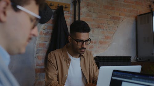 Men Wearing Eyeglasses Using Laptops