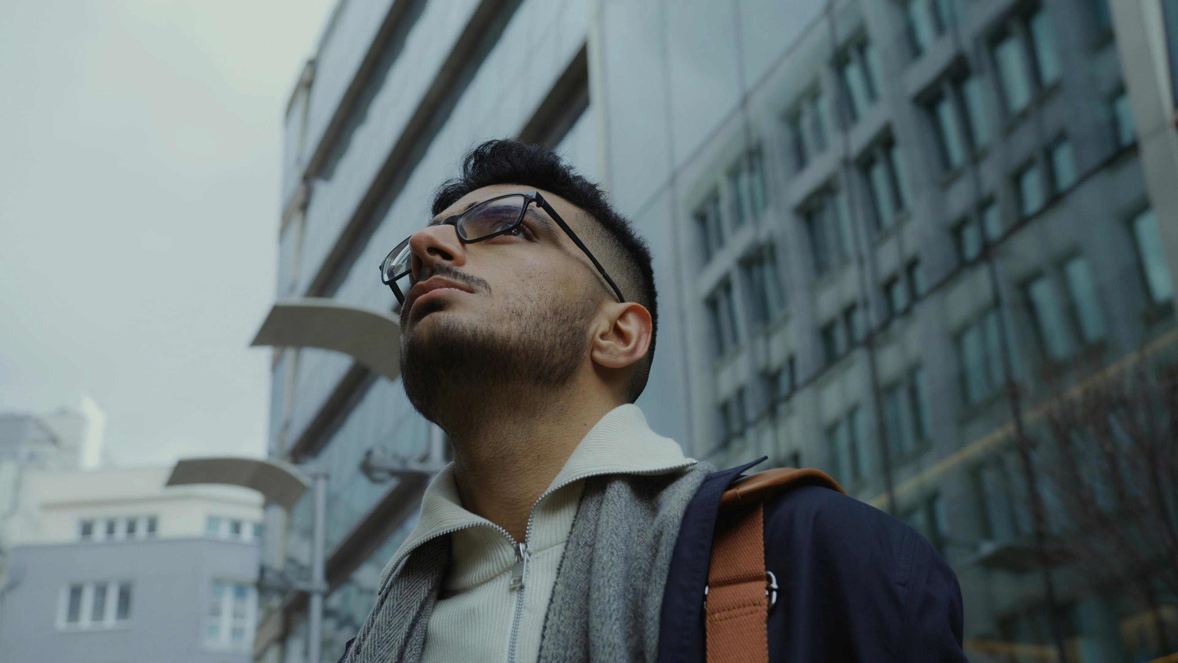 A Man Looking Around Outside the Building · Free Stock Video