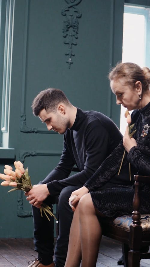 Mother and Son Mourning at a Funeral