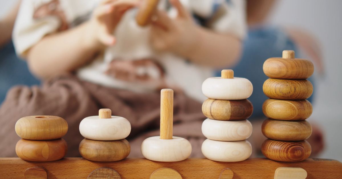 Stacking Rings Play Close-Up View of a Child Playing Wooden Stacking Rings Free Stock Video ...