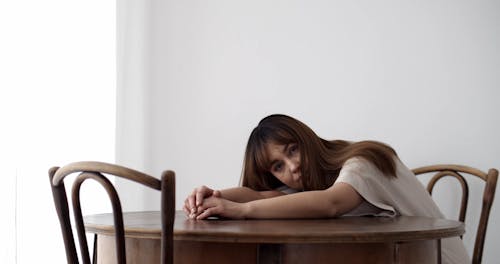 Footage of a Depressed Woman Lying on the Table