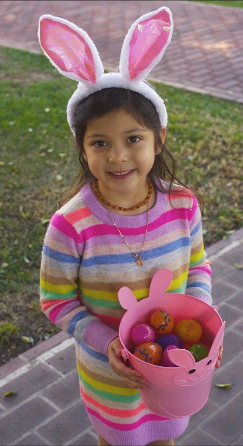 A Girl Holding a Bucket of Easter Eggs
