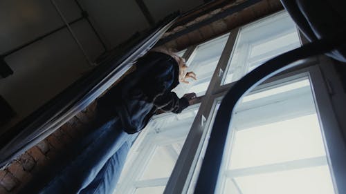 A Woman Standing by the Window