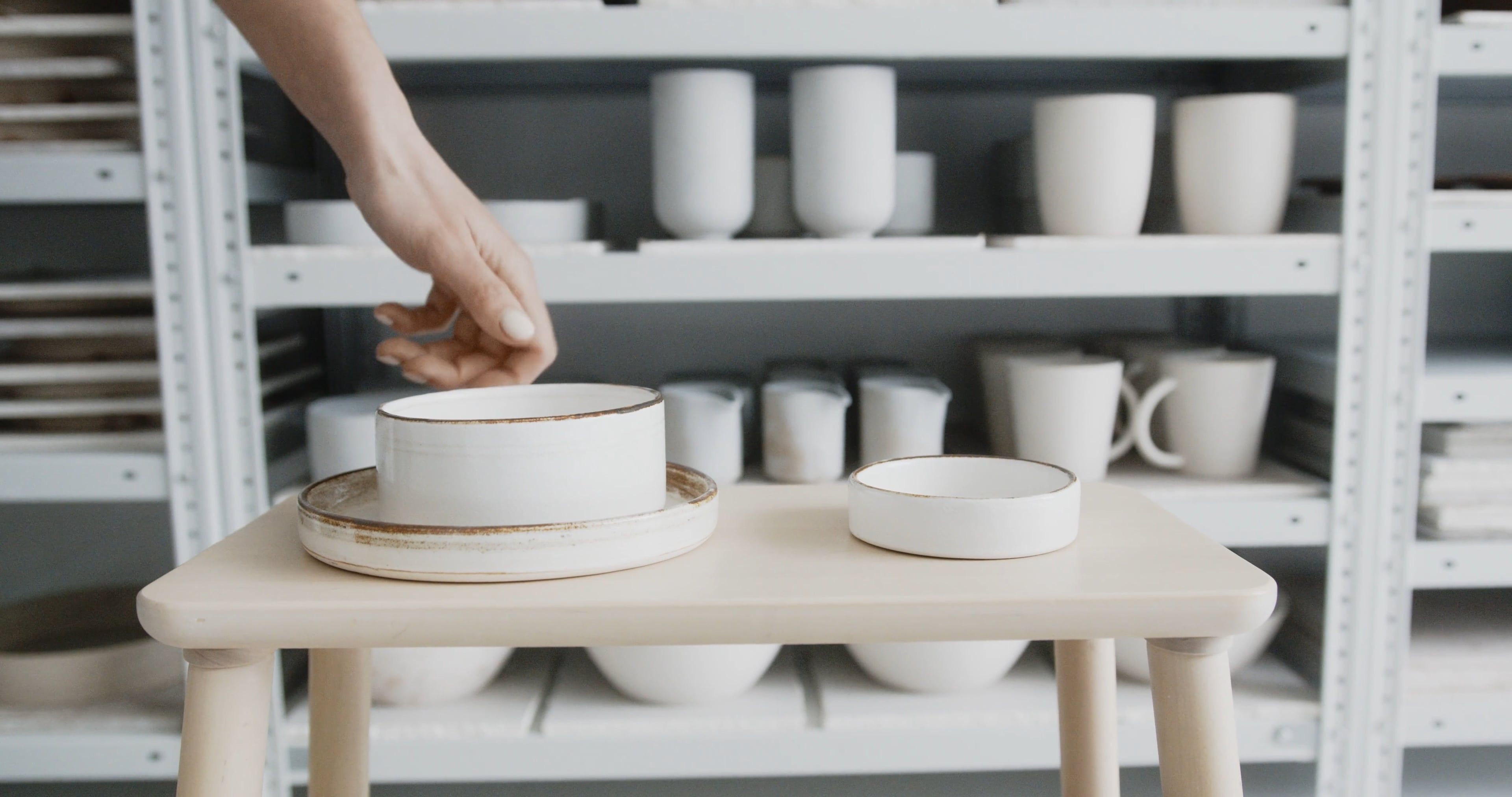 Hands holding a ceramic bowl