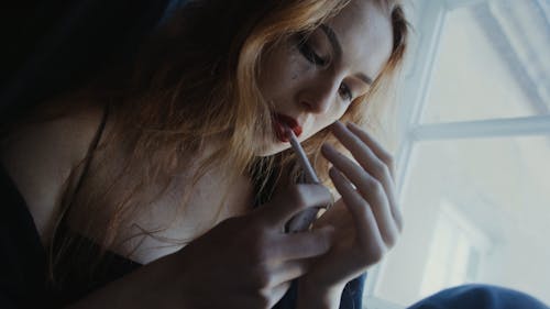 Emotional Woman Smoking Cigarette