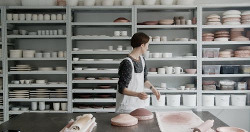 A Woman Holding a Clay Bowl