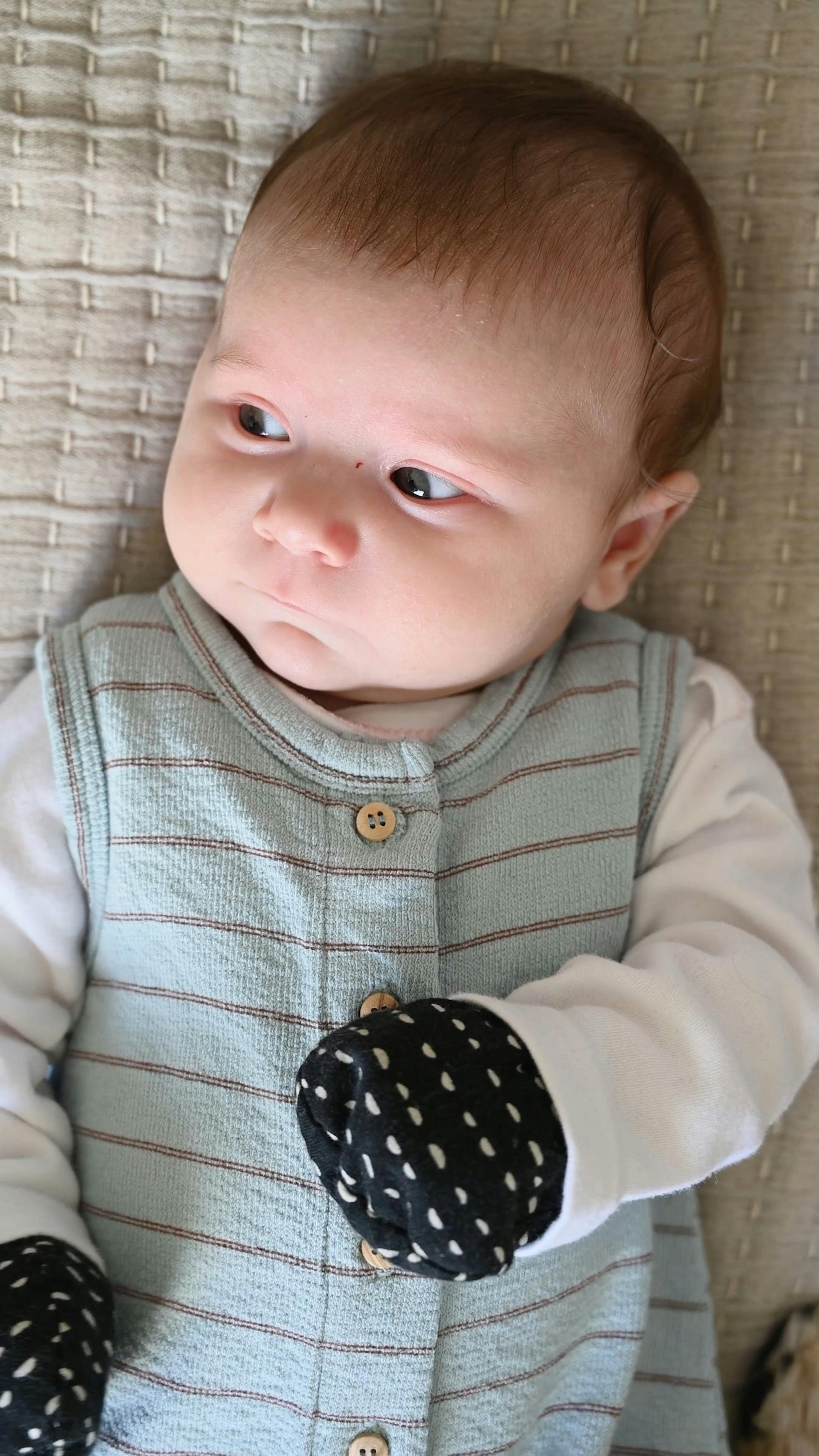 A Cute Little Baby Wearing Mittens · Free Stock Video