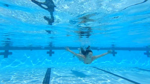 A Woman Swimming Underwater