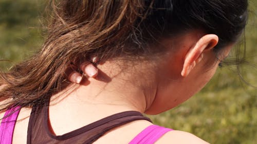 Close up of a Woman Touching her Nape