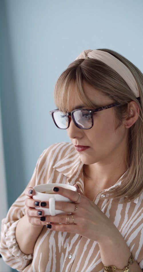 Woman with Glasses Drinking Coffee 