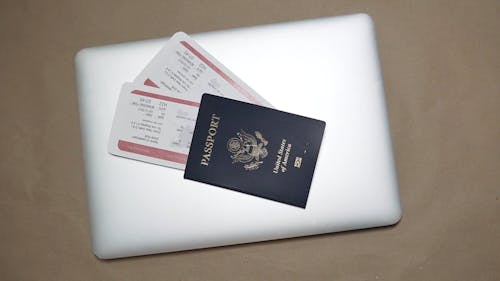 Passport on Top of a Laptop