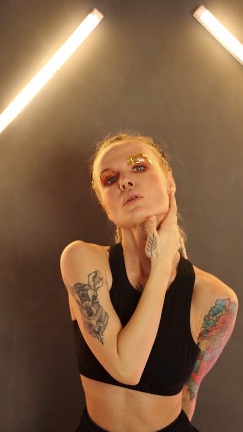 Woman with Tattoo and and Piercing Dancing Alone