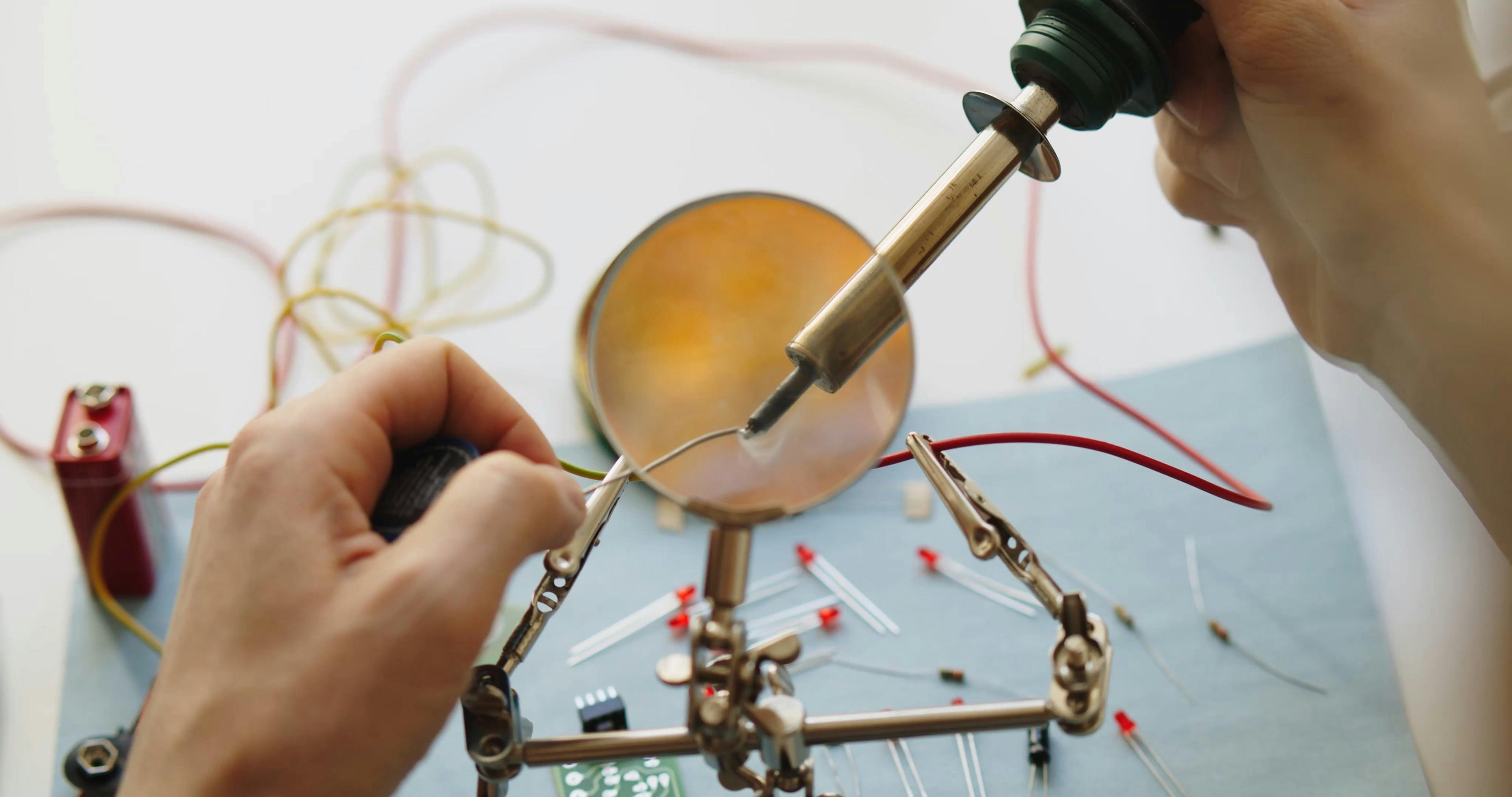 Video of a Person using Soldering Iron · Free Stock Video