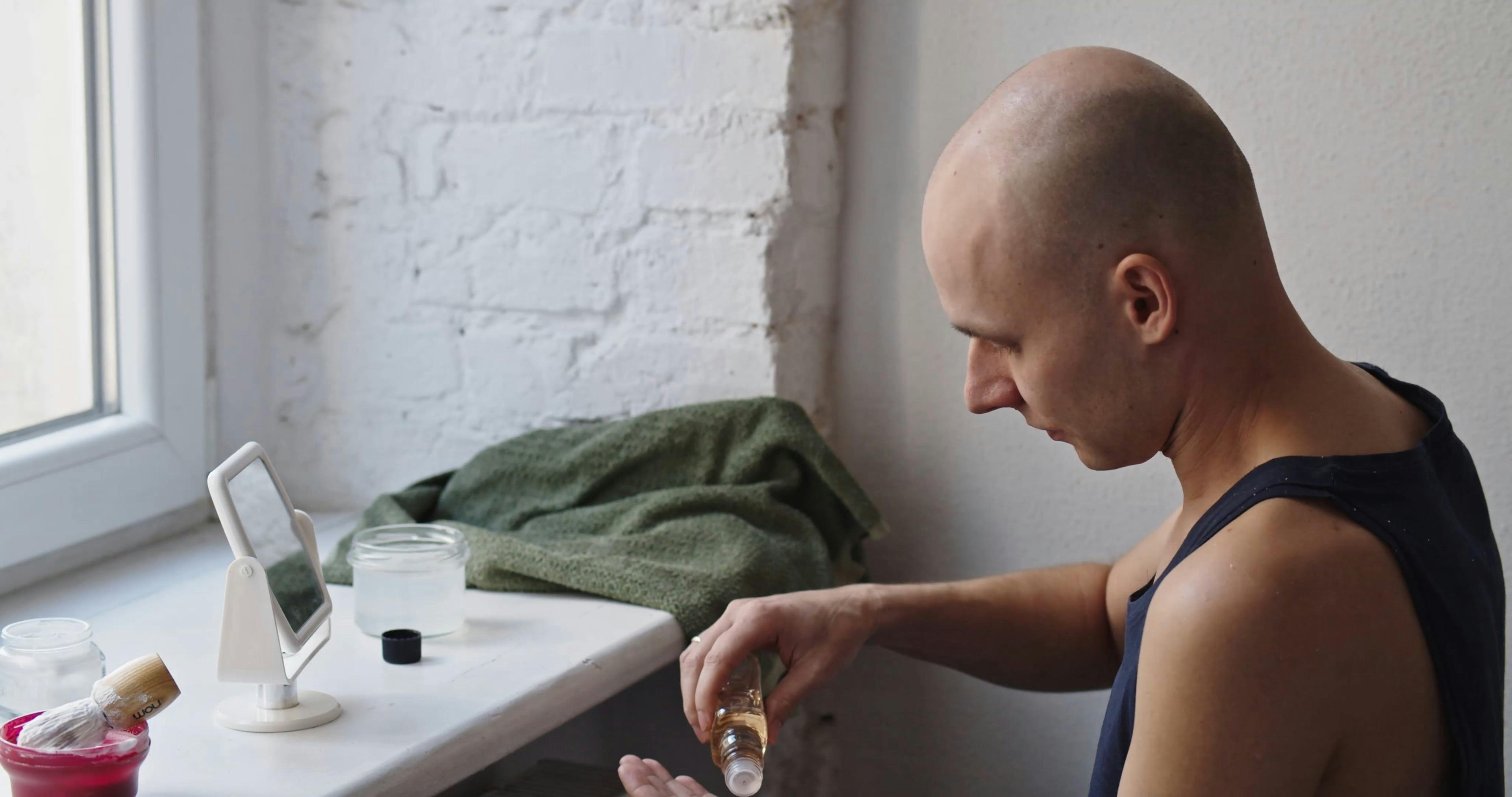 A Woman Putting Skin Care Product on Her Face \u00b7 Free Stock Video