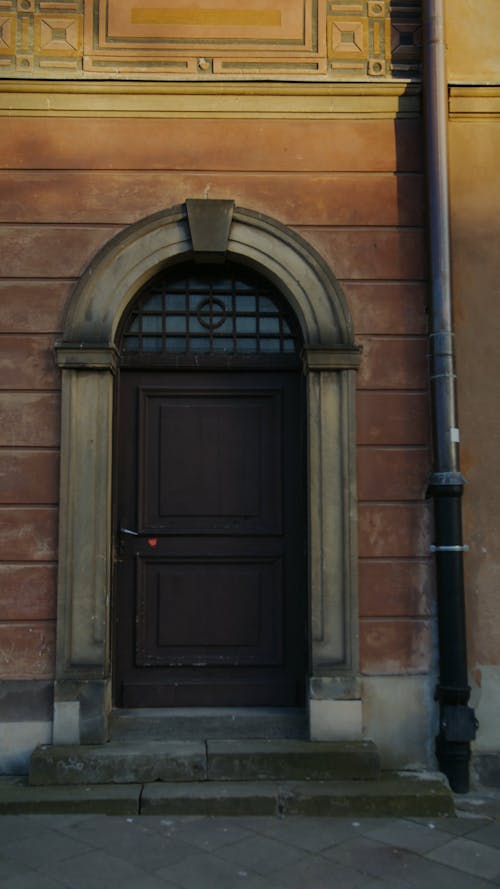 An Arched Doorway To An Old Building