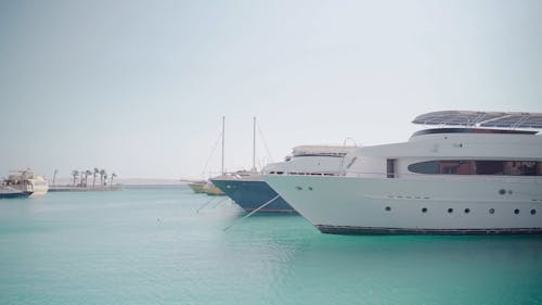 Shot of a Couple of Yachts Anchored in a Marina