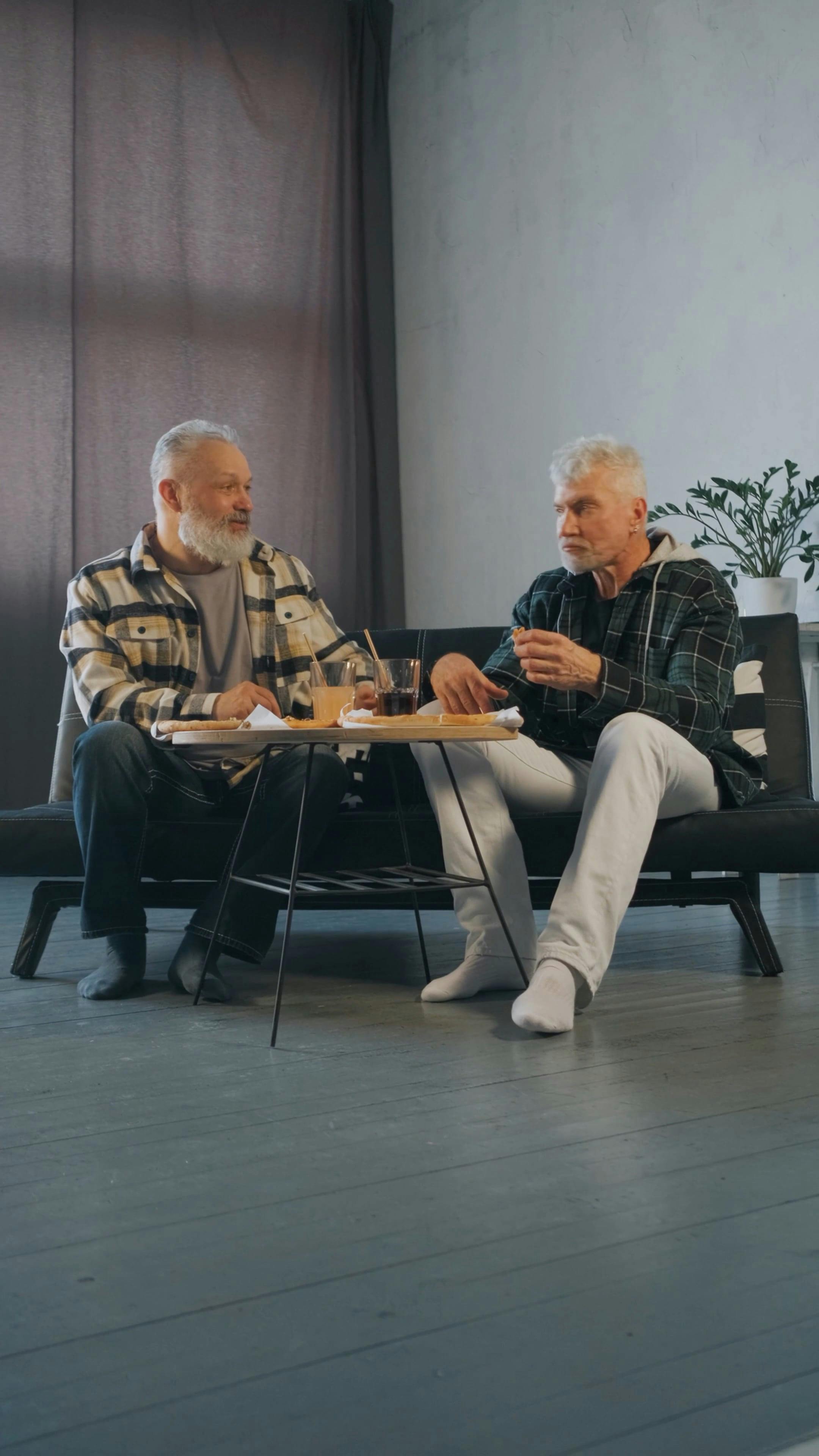 Elderly Men Talking to Each Other while Eating · Free Stock Video