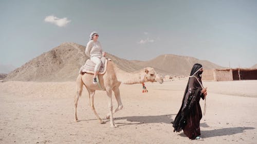 A Woman Riding a Camel