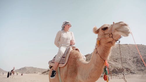 Woman Riding Camel