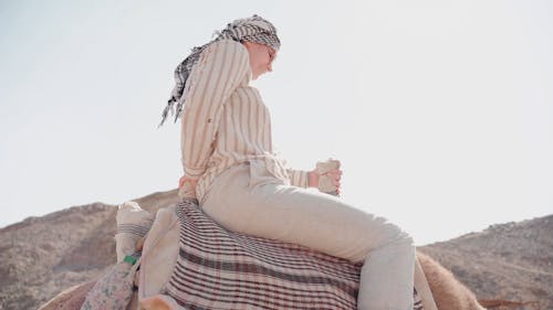 A Woman Riding a Camel