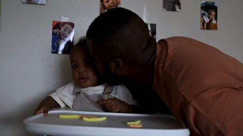 Father Kissing a Child