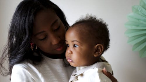 Mother Kissing a Child