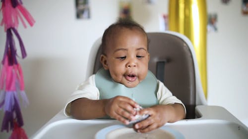 A Toddler Celebrating His First Birthday