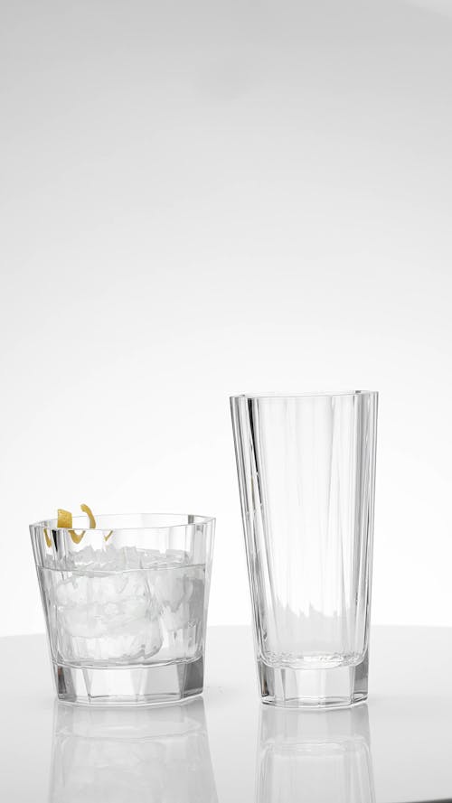 An Empty Glass and a Glass with Cocktail