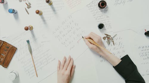 Woman Writing a Letter using Pen and Ink