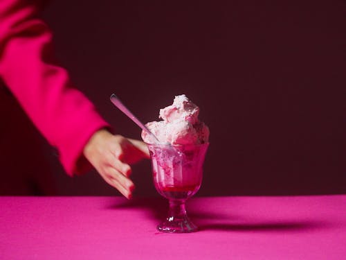 A Woman Replaces An Ice Cream With A Drink
