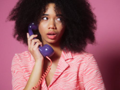 A Young Woman Talking On The Telephone